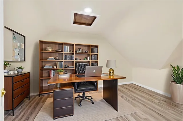 a view of a workspace with furniture