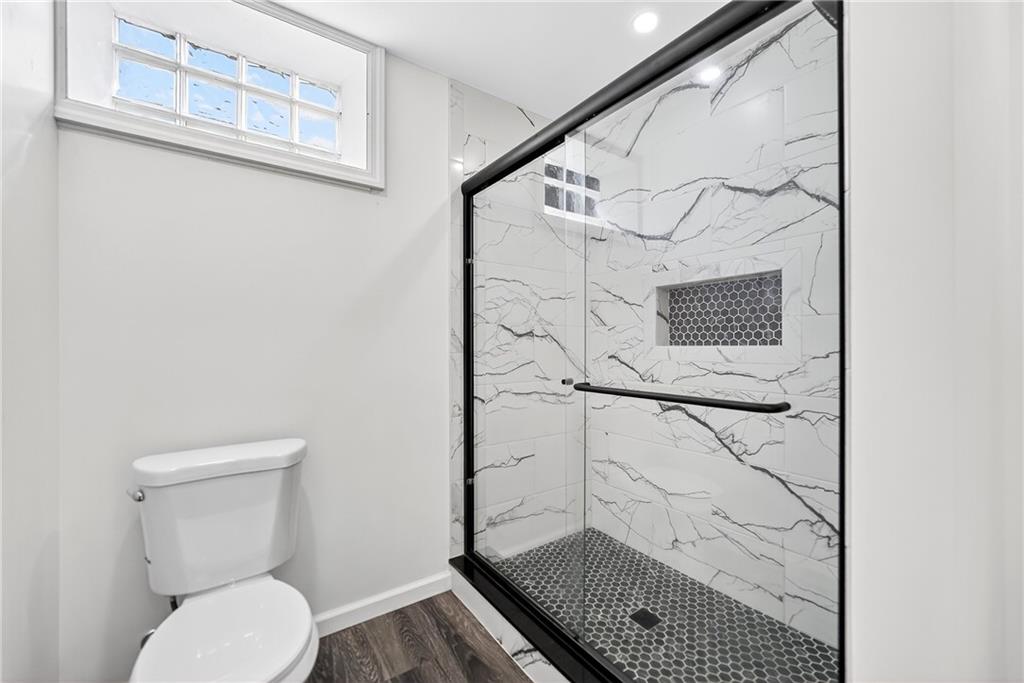 545 Vanderbilt Road Connellsville, PA 15425 - Photo 46 of 49 a bathroom with a toilet and a shower