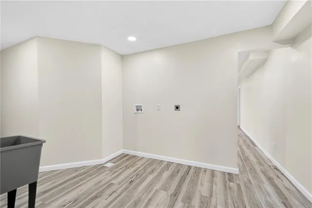 a view of room with wooden floor