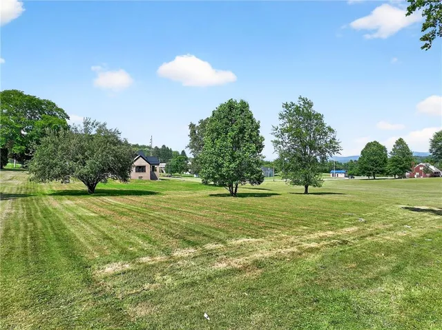 a view of a golf course with a trees
