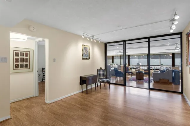 a view of a livingroom with furniture and a hardwood floor