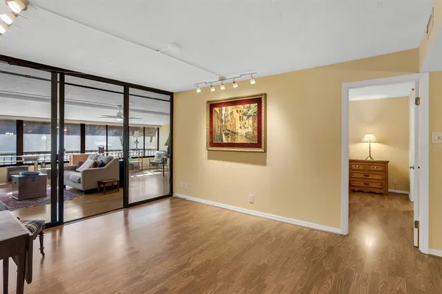 a view of a livingroom with furniture wooden floor and a window