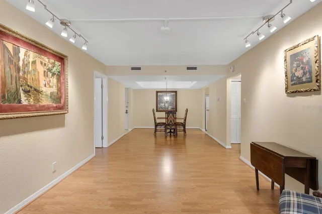a view of a kitchen with stainless steel appliances granite countertop a refrigerator and a sink