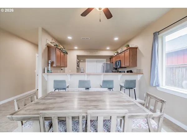 a kitchen with kitchen island stainless steel appliances a sink and cabinets