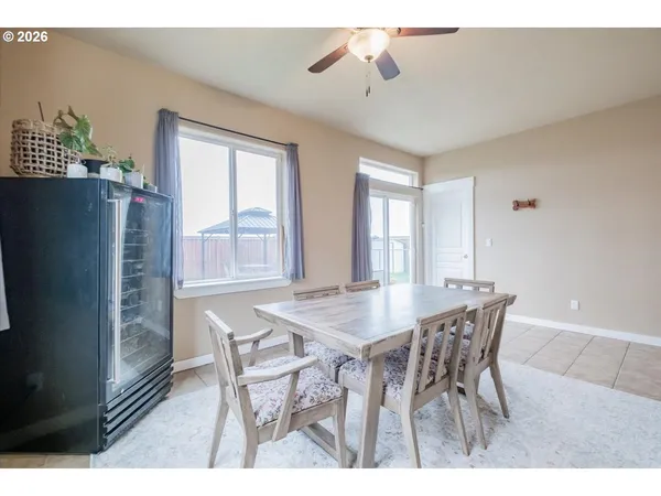 a view of a dining room with furniture and window