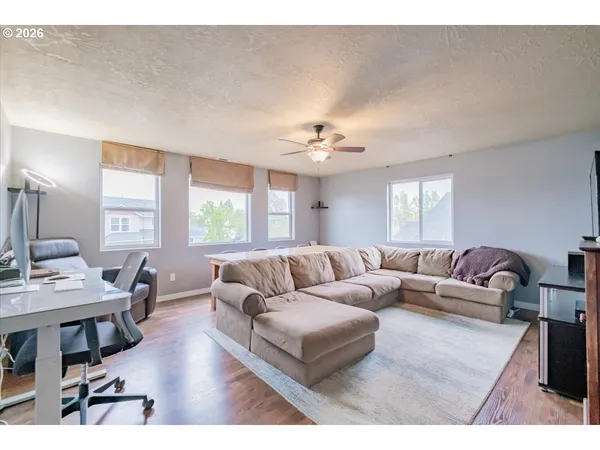 a living room with furniture and a large window