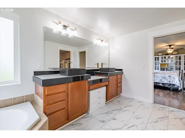 a kitchen with a sink and cabinets