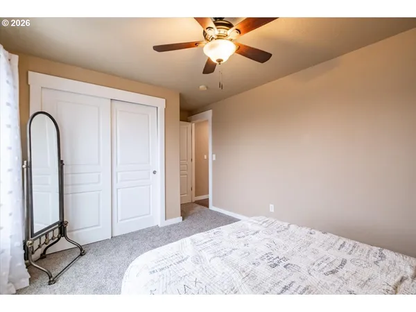 a view of a bedroom with a flat screen tv