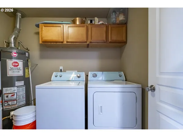 a utility room with dryer and washer