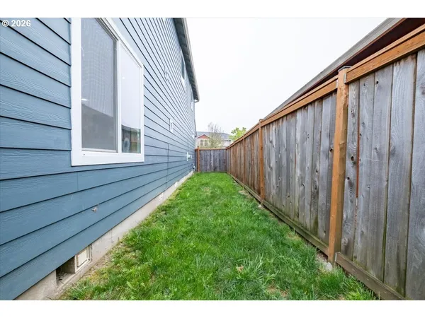 a view of a backyard with potted plants