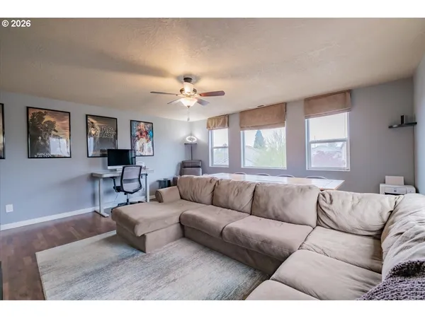 a living room with furniture and a large window