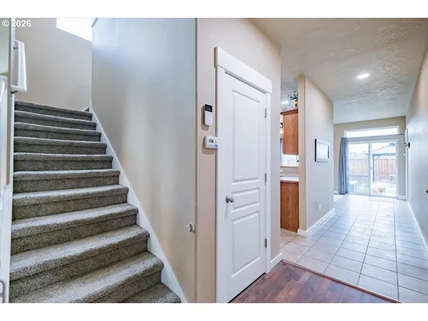 a view of an entryway with wooden floor