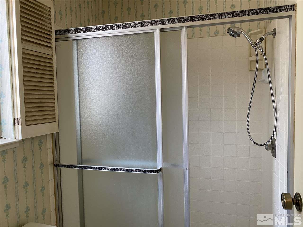 1207 Searchlite Court Reno, NV 89503 - Photo 17 of 17 a bathroom with a glass shower door