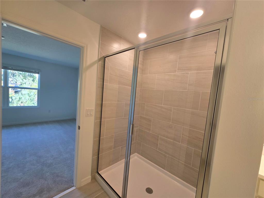 1147 Happy Frst Loop DeLand, FL 32720 - Photo 7 of 10 a bathroom with a shower and a window