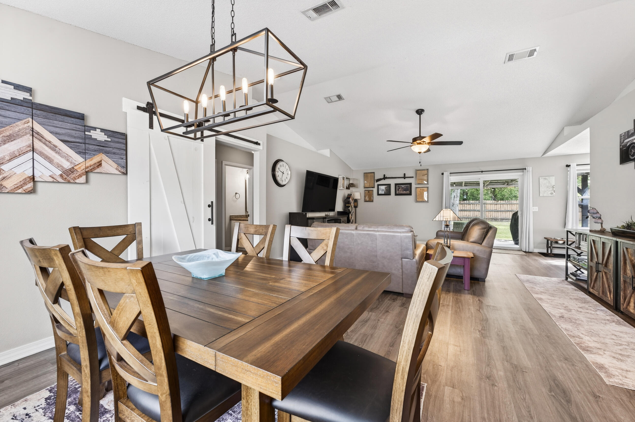 4331 Crosswind Drive Milton, FL 32583 - Photo 11 of 50 a view of a dining room with furniture and wooden floor