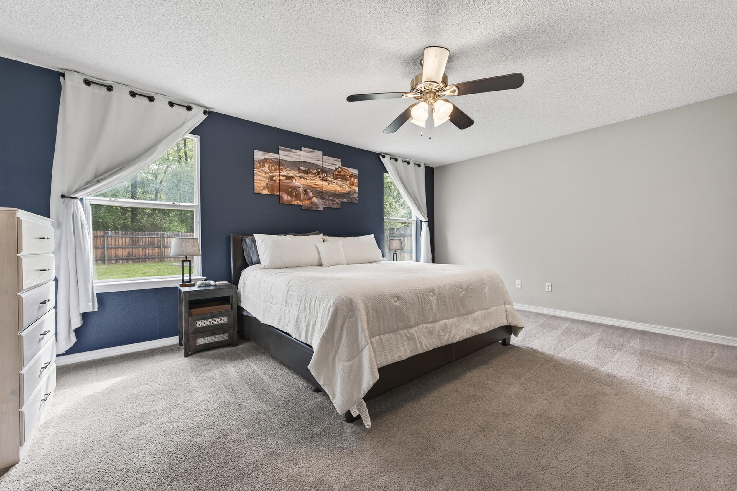 4331 Crosswind Drive Milton, FL 32583 - Photo 19 of 50 a bedroom with a bed and a large window