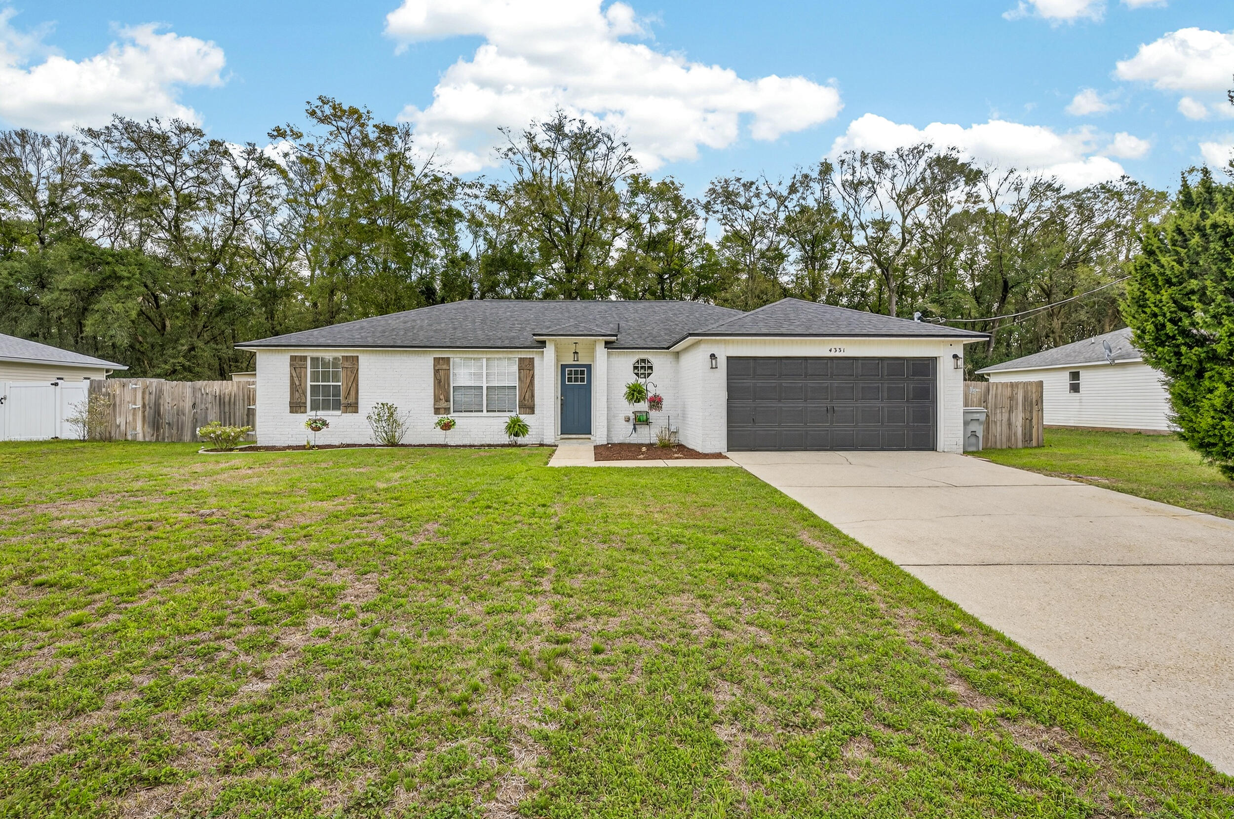 4331 Crosswind Drive Milton, FL 32583 - Photo 2 of 50 a house view with a garden space