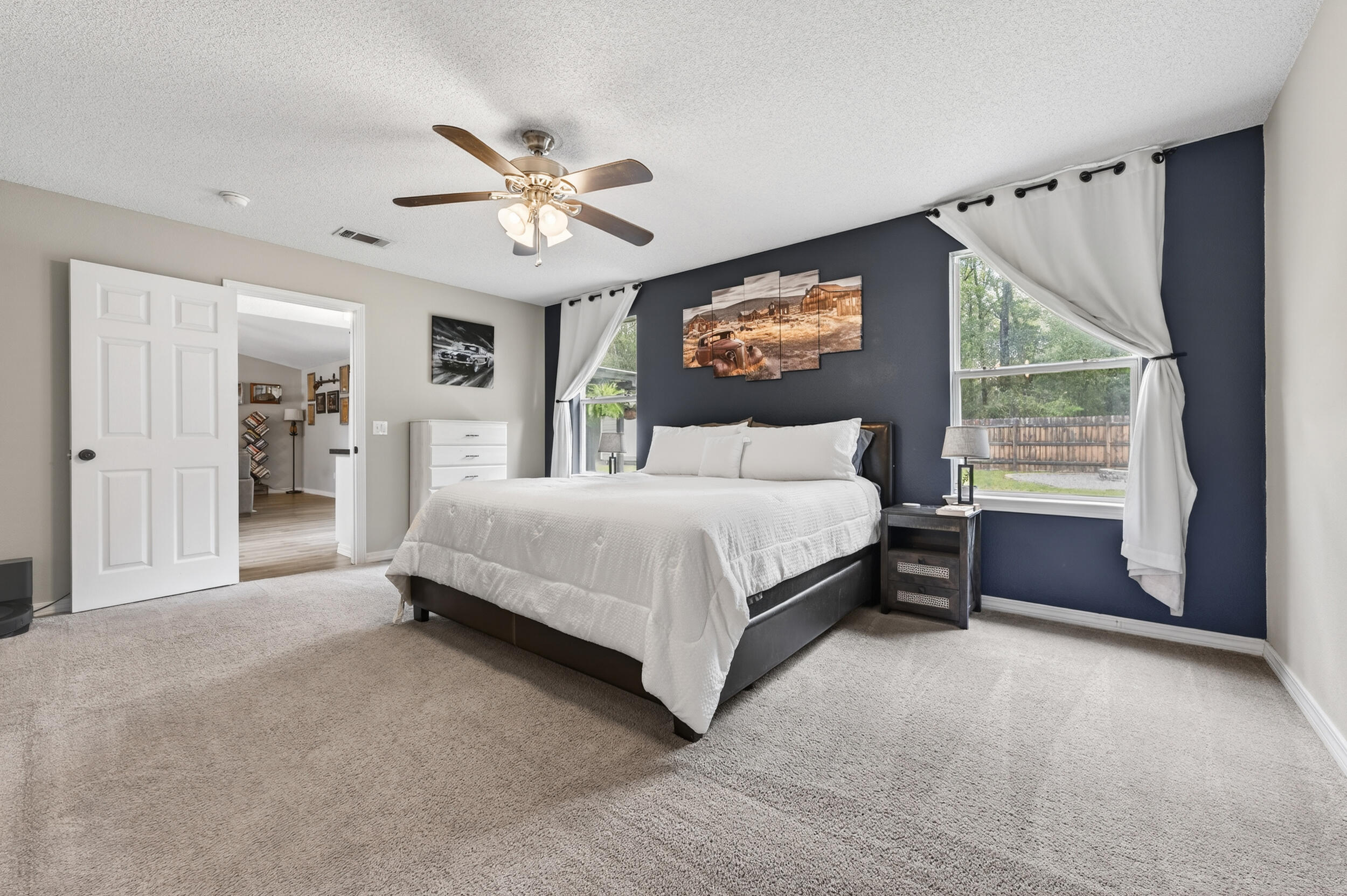 4331 Crosswind Drive Milton, FL 32583 - Photo 21 of 50 a bedroom with a bed and a large window