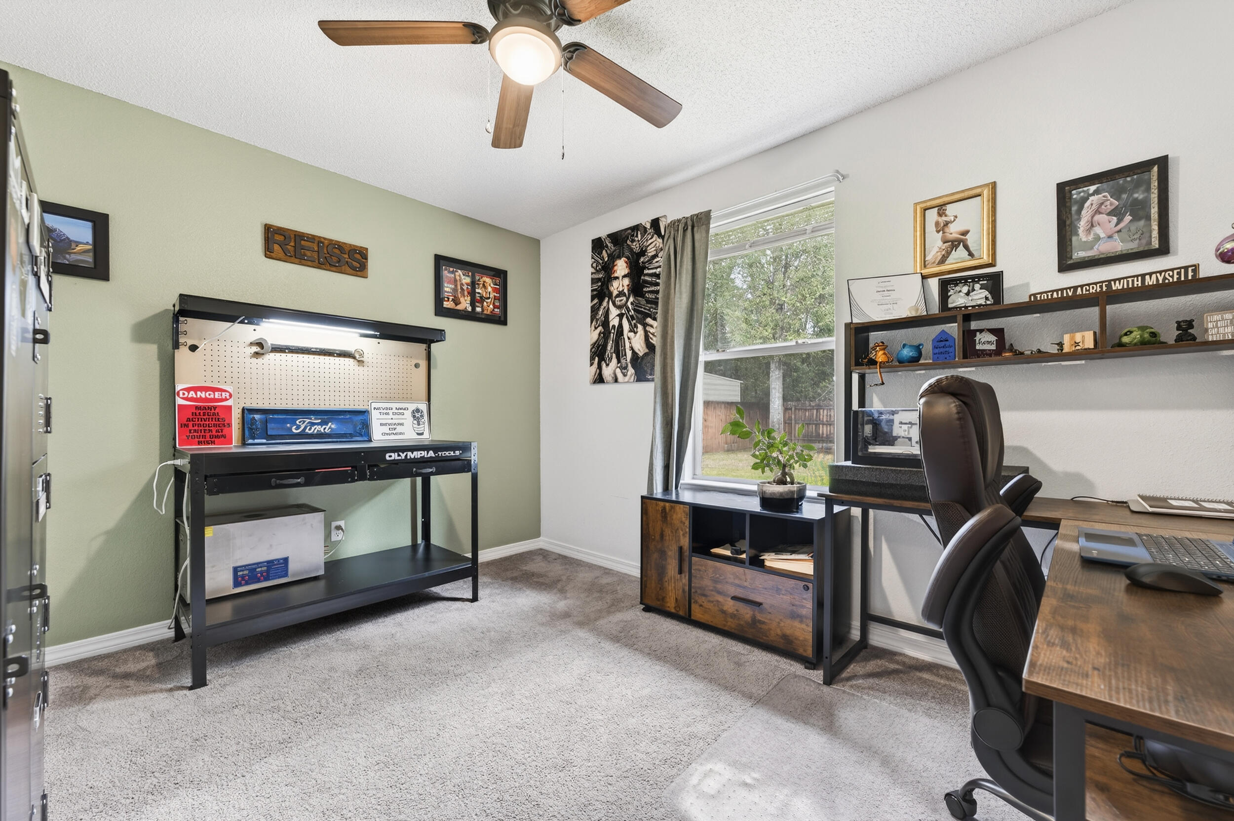 4331 Crosswind Drive Milton, FL 32583 - Photo 31 of 50 a view of a workspace with furniture and a window