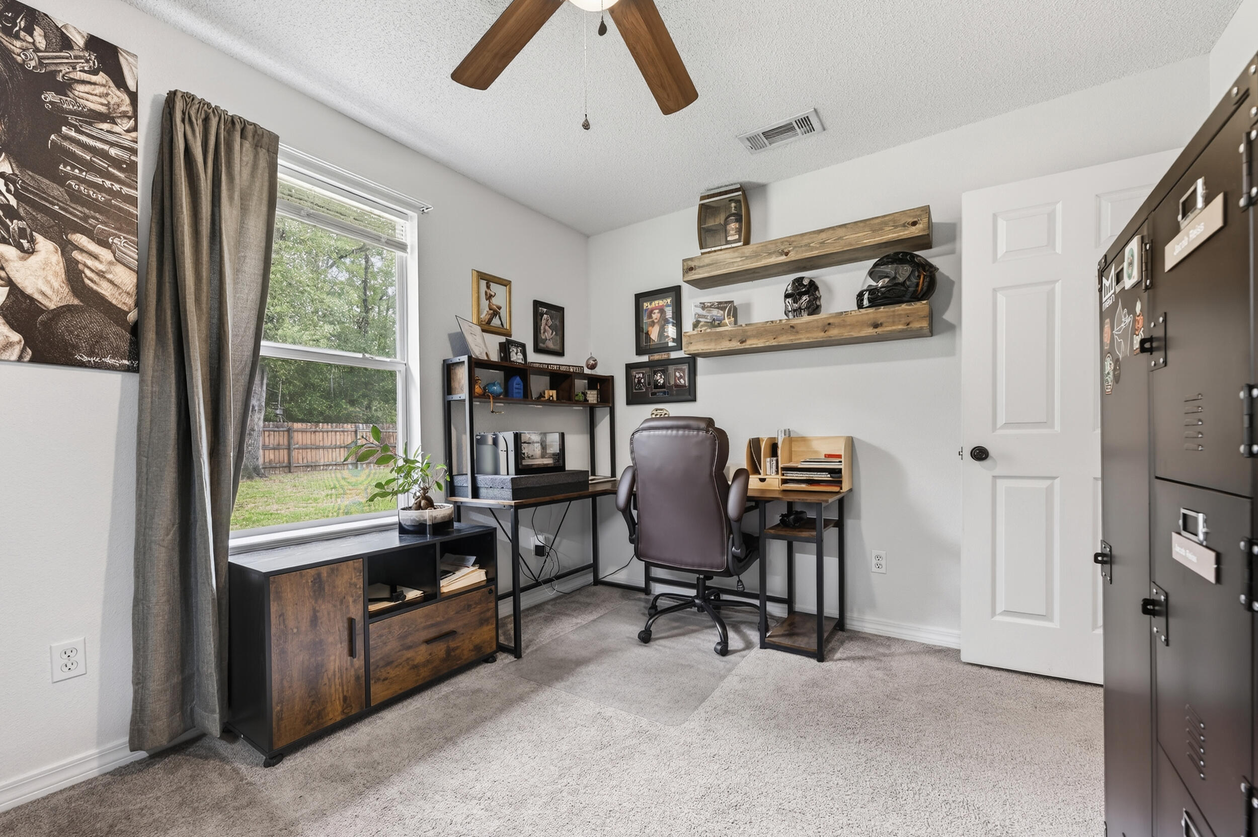 4331 Crosswind Drive Milton, FL 32583 - Photo 32 of 50 a view of a workspace with furniture and a window