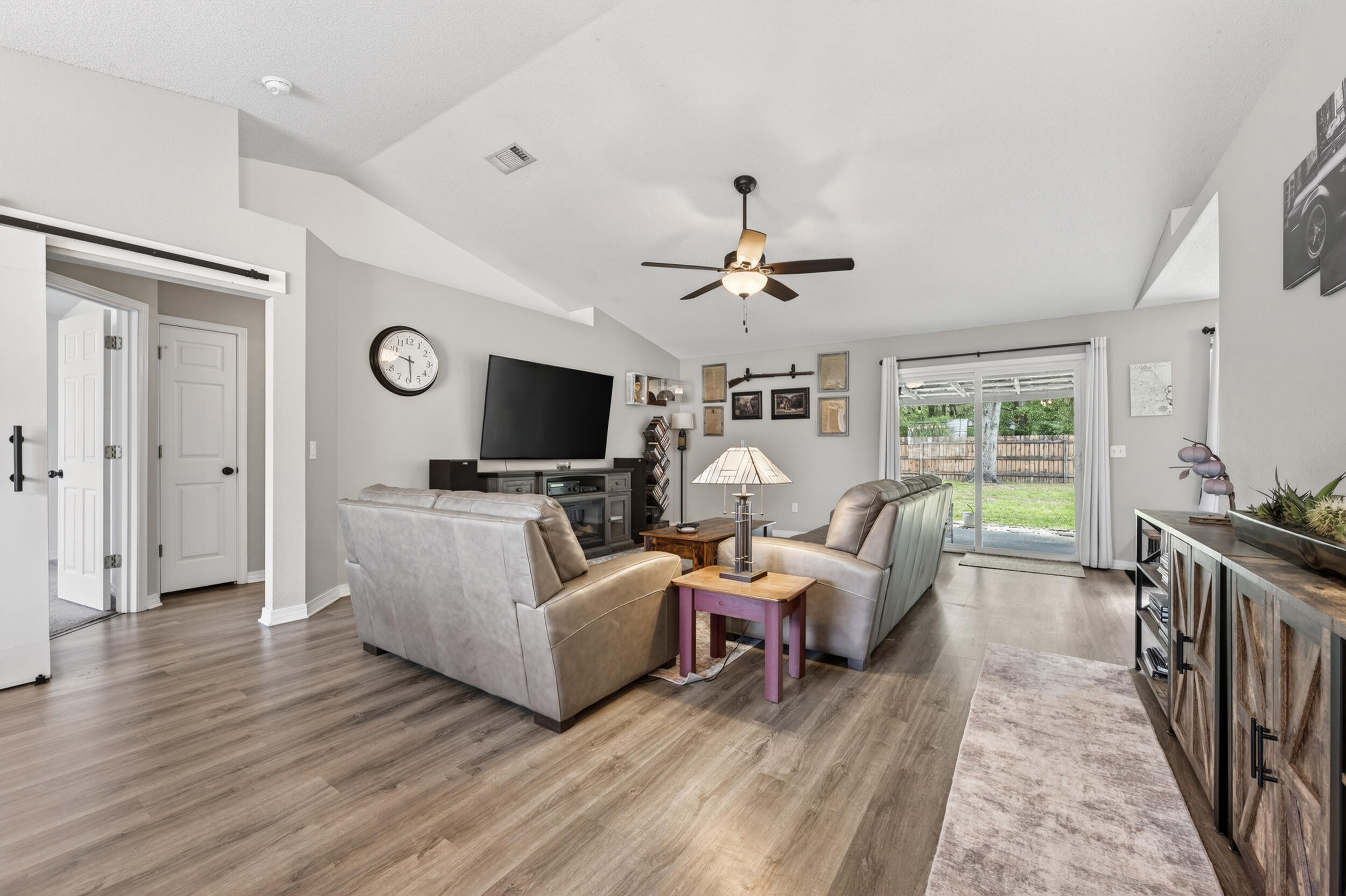 4331 Crosswind Drive Milton, FL 32583 - Photo 4 of 50 a living room with furniture and a flat screen tv