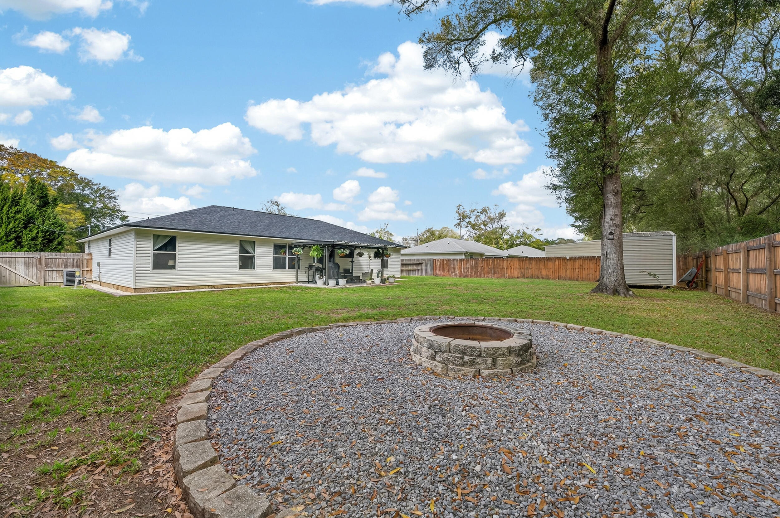 4331 Crosswind Drive Milton, FL 32583 - Photo 42 of 50 a front view of a house with a yard