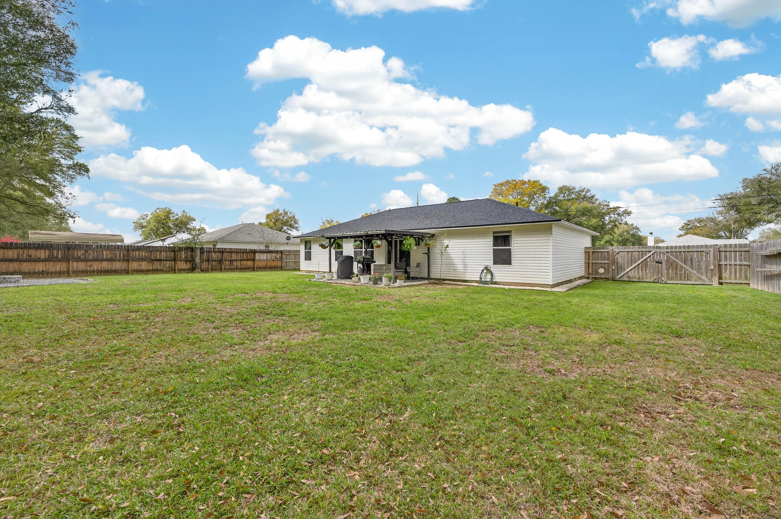 4331 Crosswind Drive Milton, FL 32583 - Photo 45 of 50 a front view of a house with garden