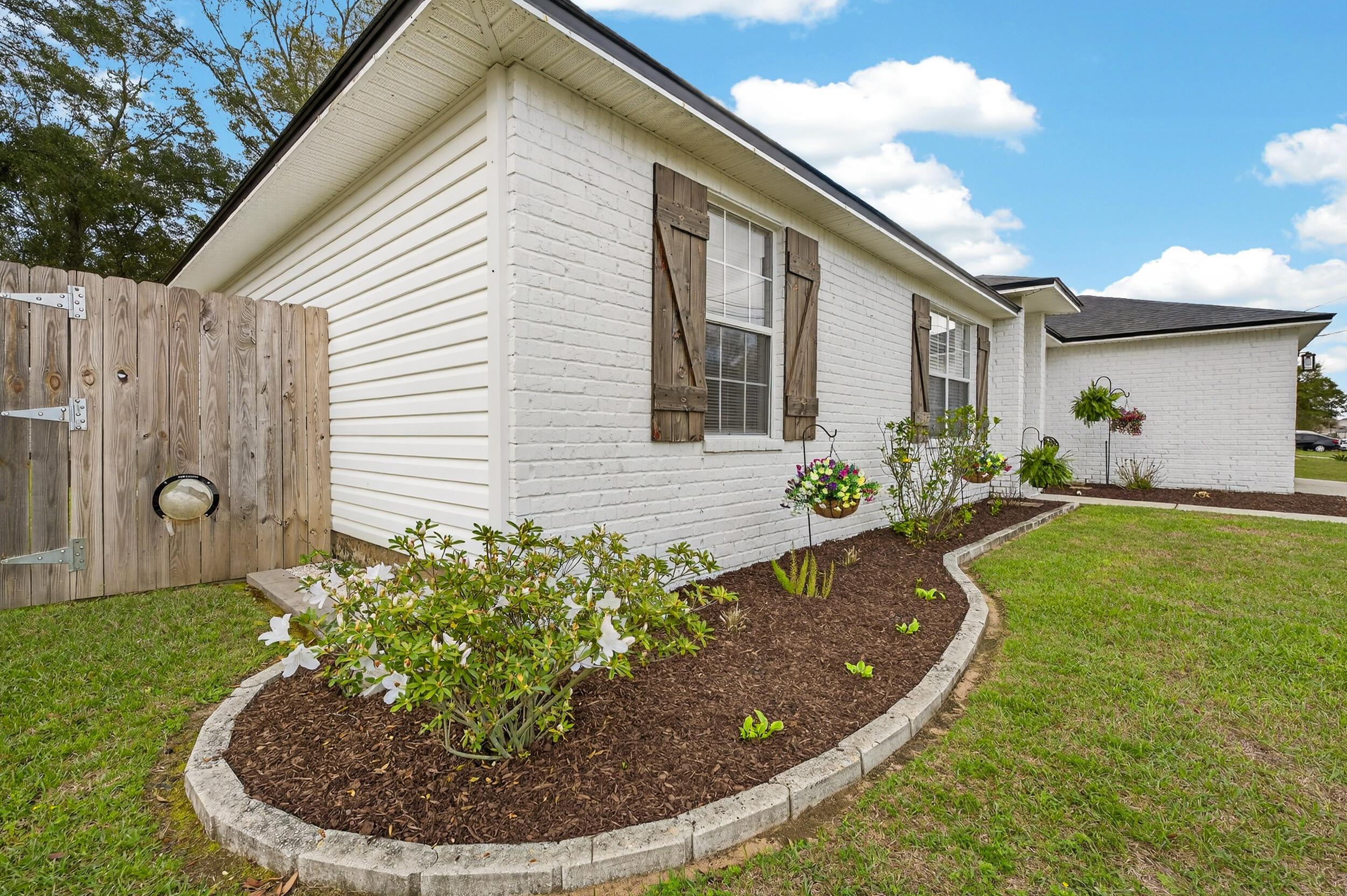 4331 Crosswind Drive Milton, FL 32583 - Photo 48 of 50 a view of a house with a backyard