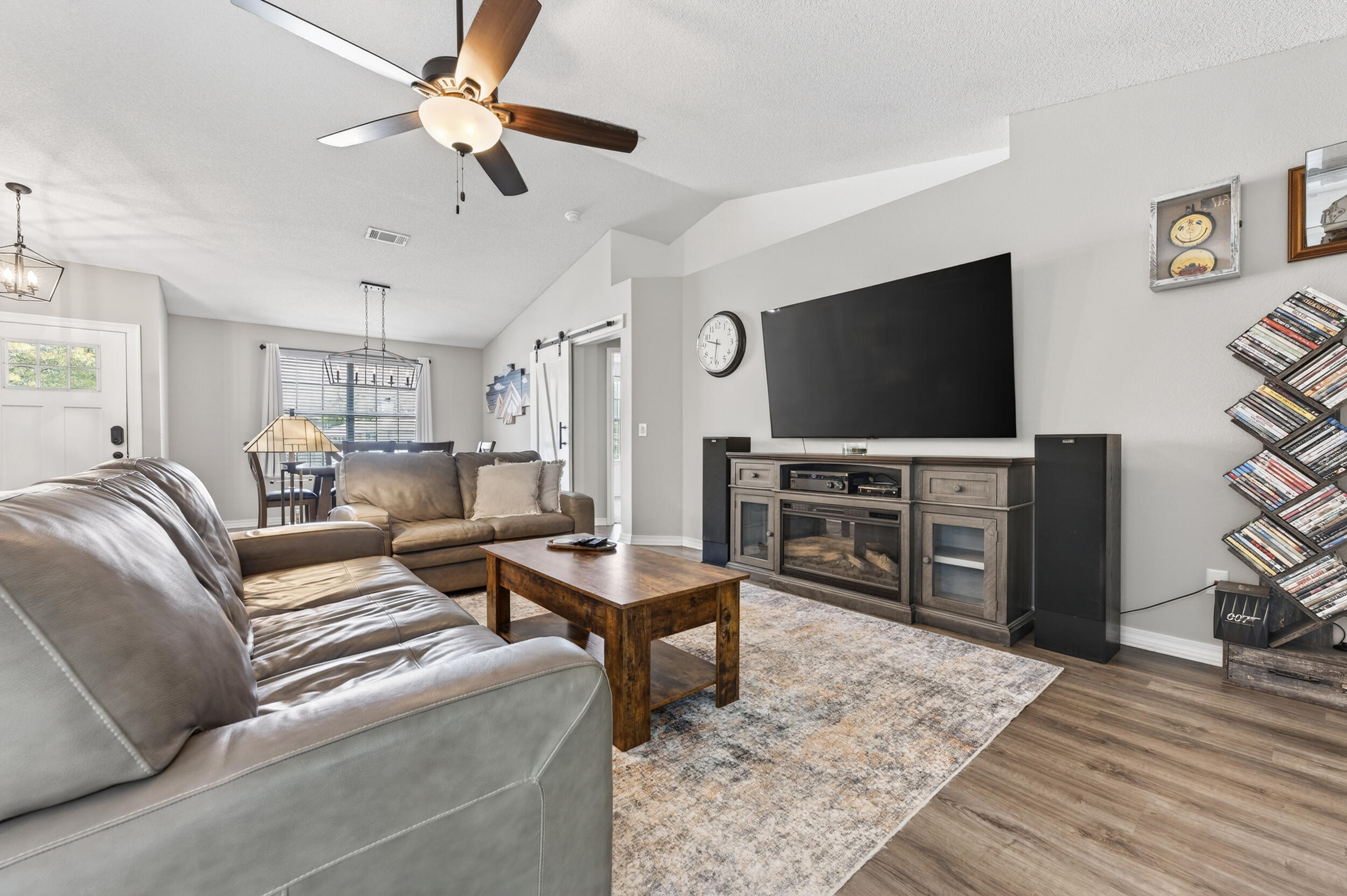 4331 Crosswind Drive Milton, FL 32583 - Photo 6 of 50 a living room with furniture and a flat screen tv