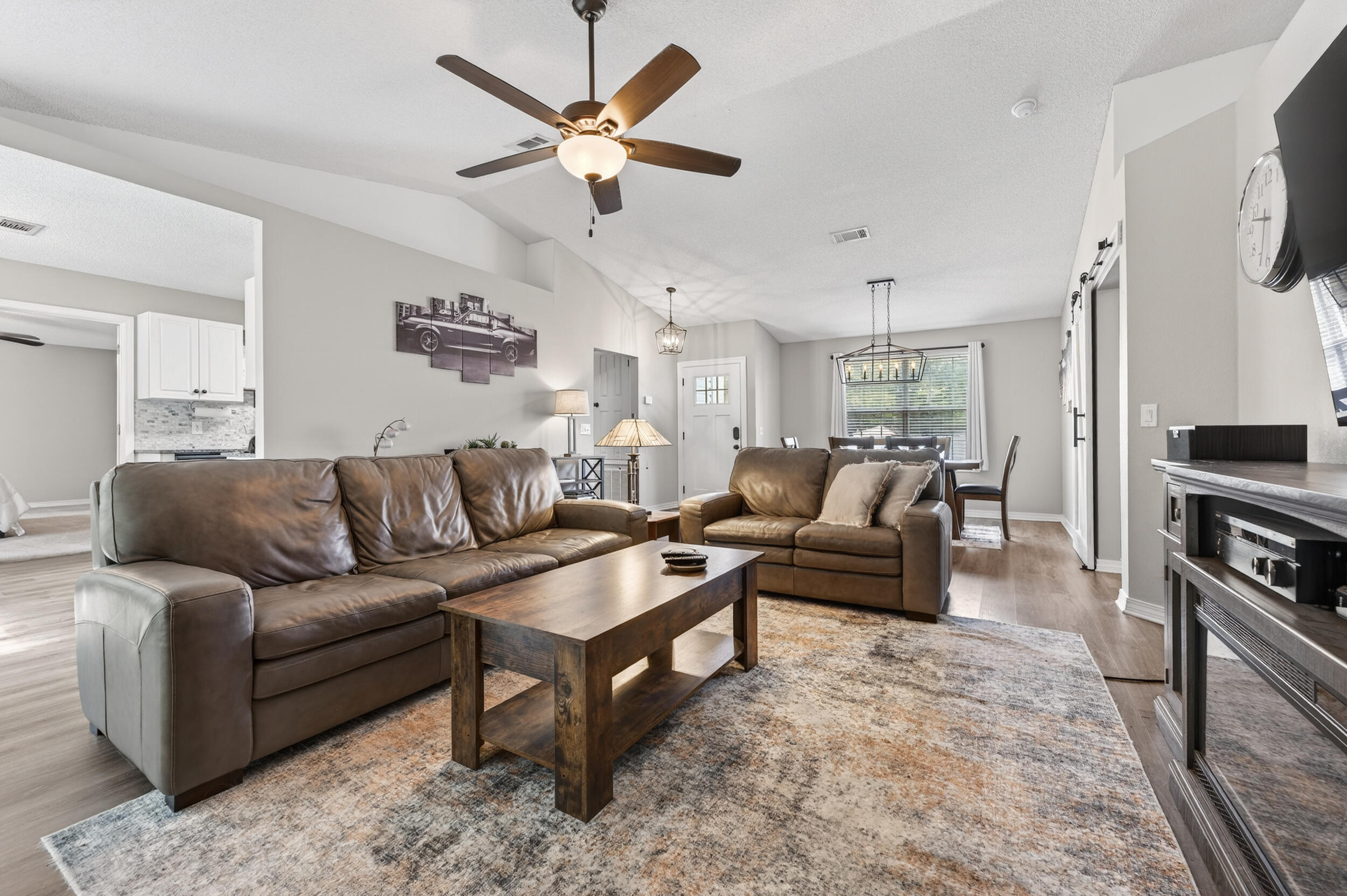 4331 Crosswind Drive Milton, FL 32583 - Photo 7 of 50 a living room with furniture and a flat screen tv