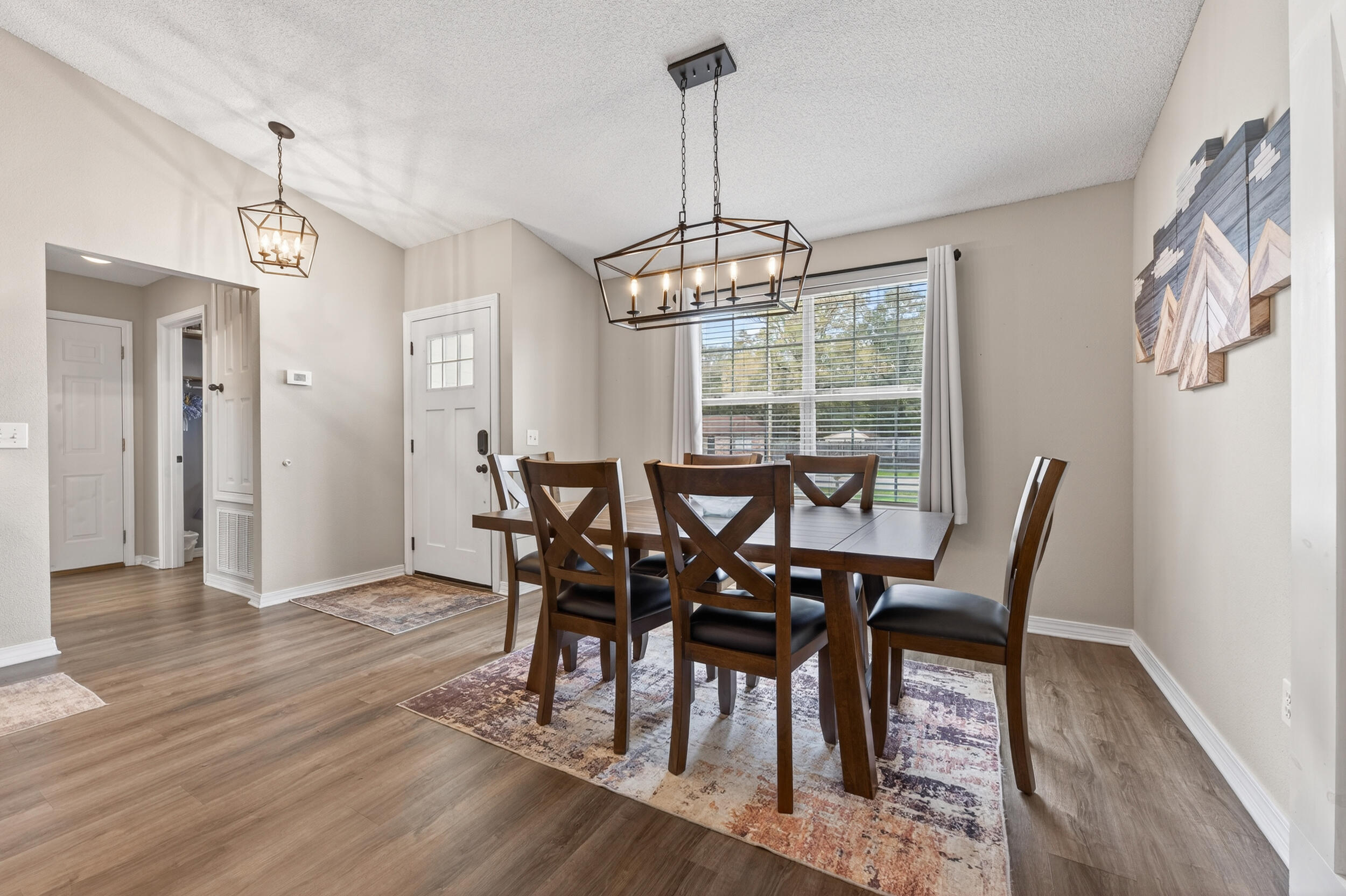 4331 Crosswind Drive Milton, FL 32583 - Photo 8 of 50 a view of a dining room with furniture window and wooden floor