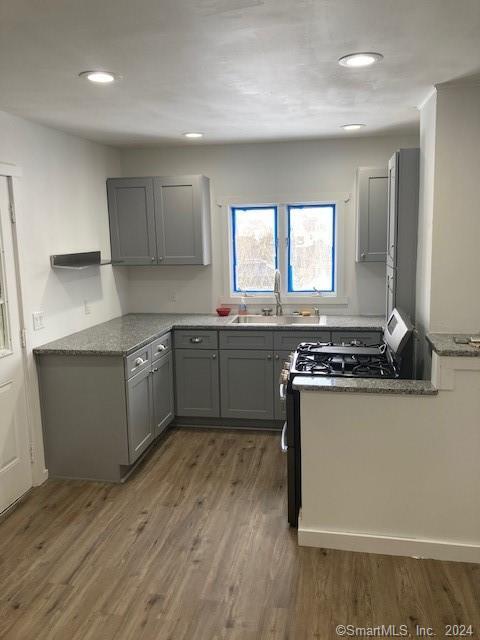 44 High Bridge Road, Unit A Litchfield, CT 06750 - Photo 1 of 1 a kitchen with stainless steel appliances granite countertop a stove a sink and a refrigerator