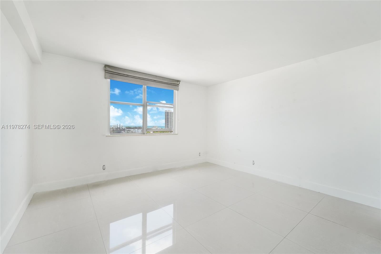 401 69th Street, Unit 913 Miami Beach, FL 33141 - Photo 15 of 26 an empty room with a window