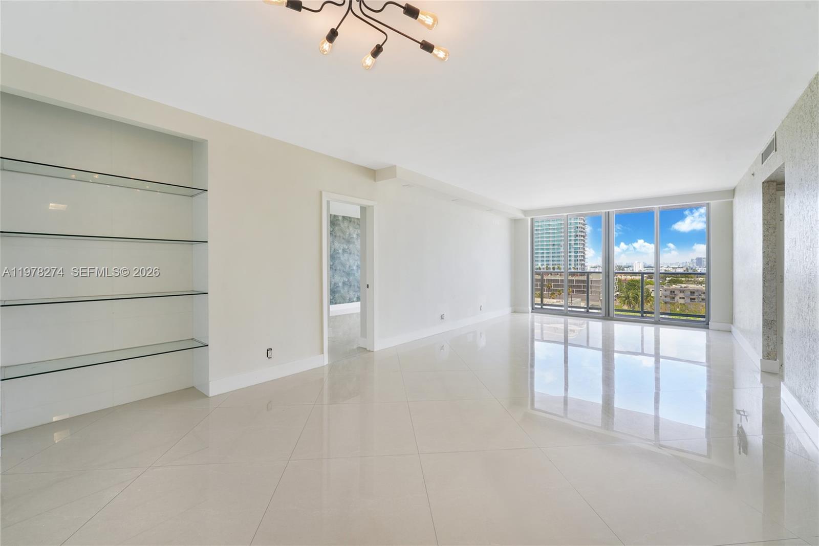 401 69th Street, Unit 913 Miami Beach, FL 33141 - Photo 2 of 26 a view of an empty room with a window
