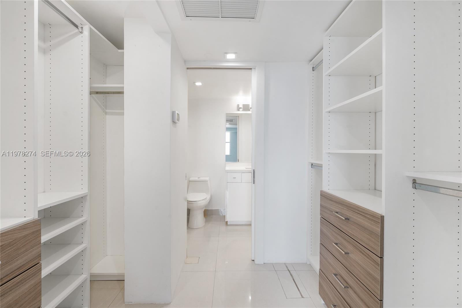 401 69th Street, Unit 913 Miami Beach, FL 33141 - Photo 9 of 26 a bathroom with a sink and a mirror