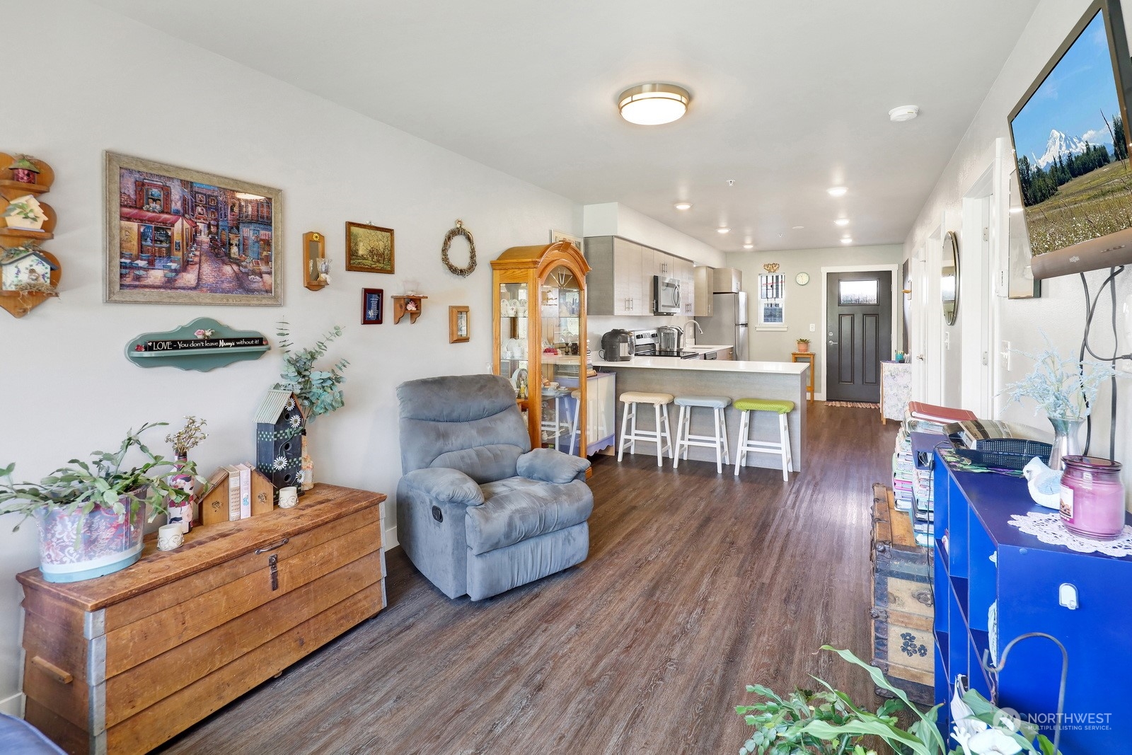 1882 Front Street, Unit 111 Lynden, WA 98264 - Photo 12 of 29 a living room with furniture and wooden floor