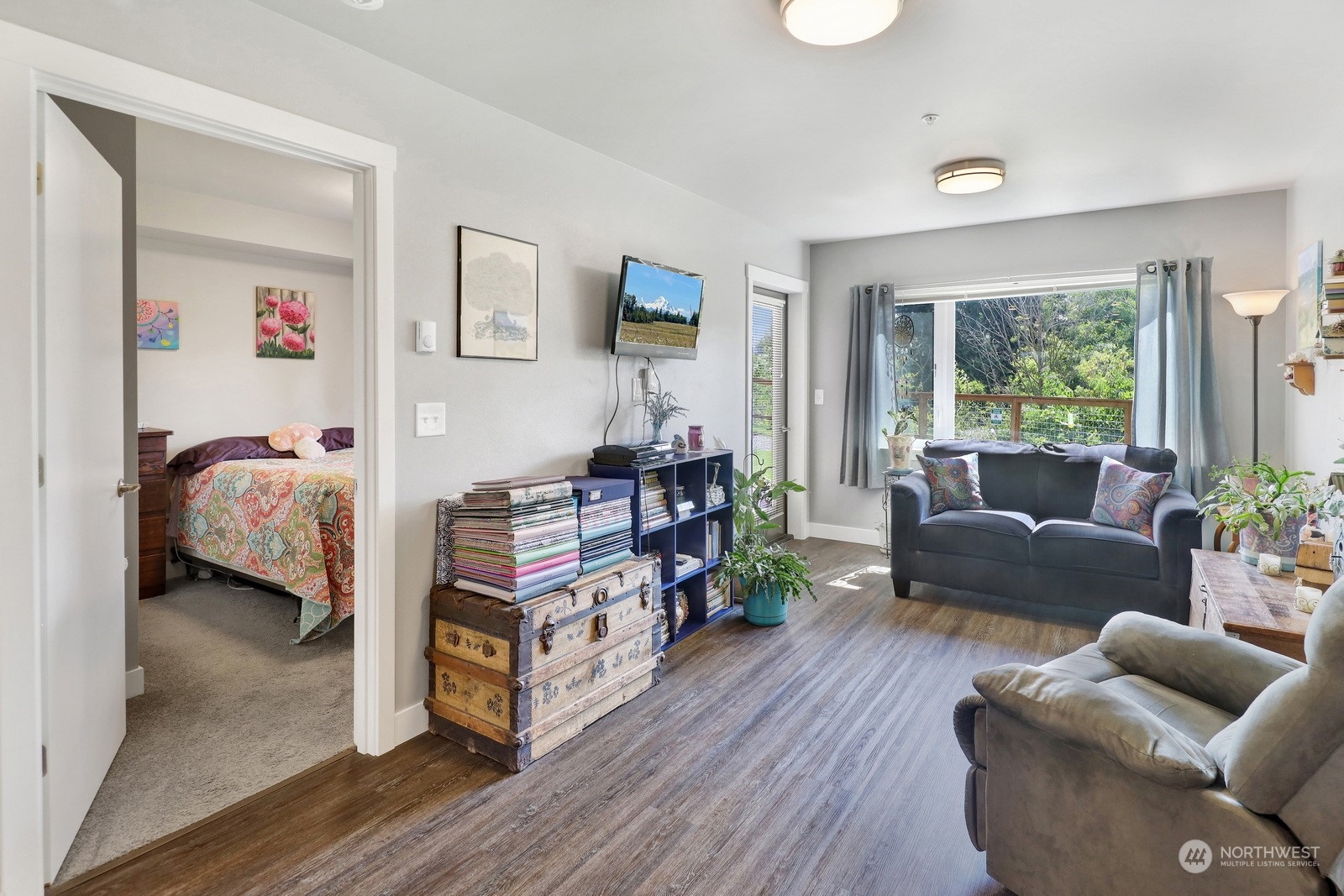 1882 Front Street, Unit 111 Lynden, WA 98264 - Photo 15 of 29 a living room with furniture and a wooden floor
