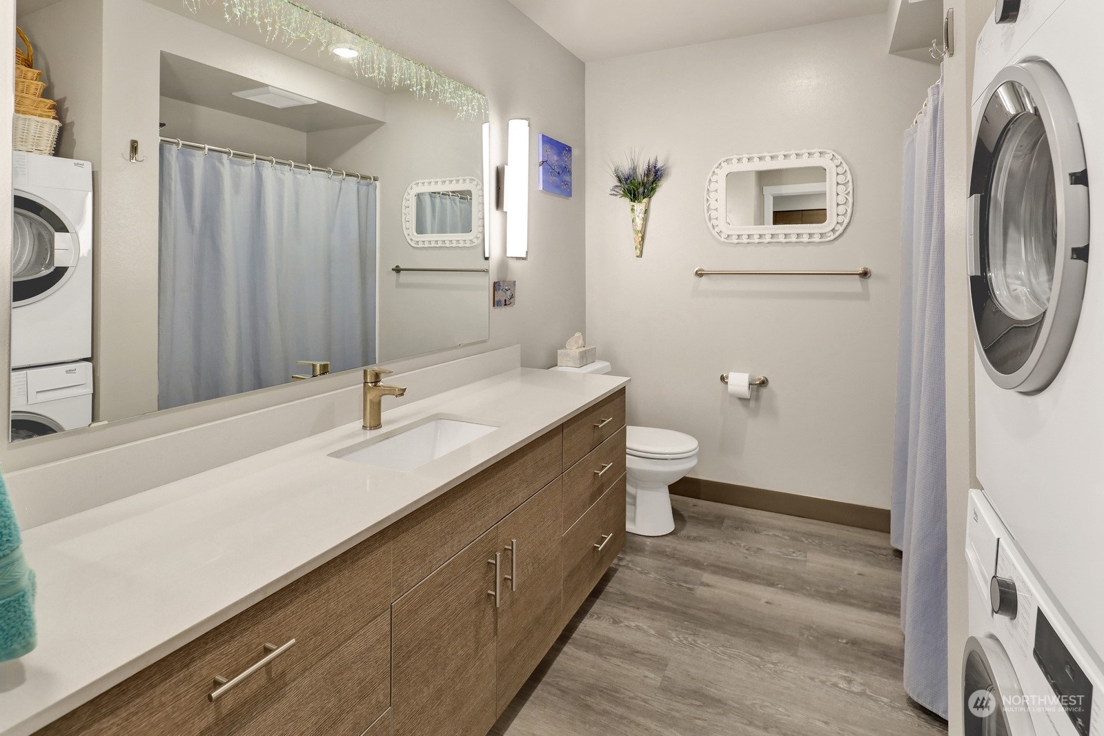 1882 Front Street, Unit 111 Lynden, WA 98264 - Photo 18 of 29 a bathroom with a double vanity sink and a mirror