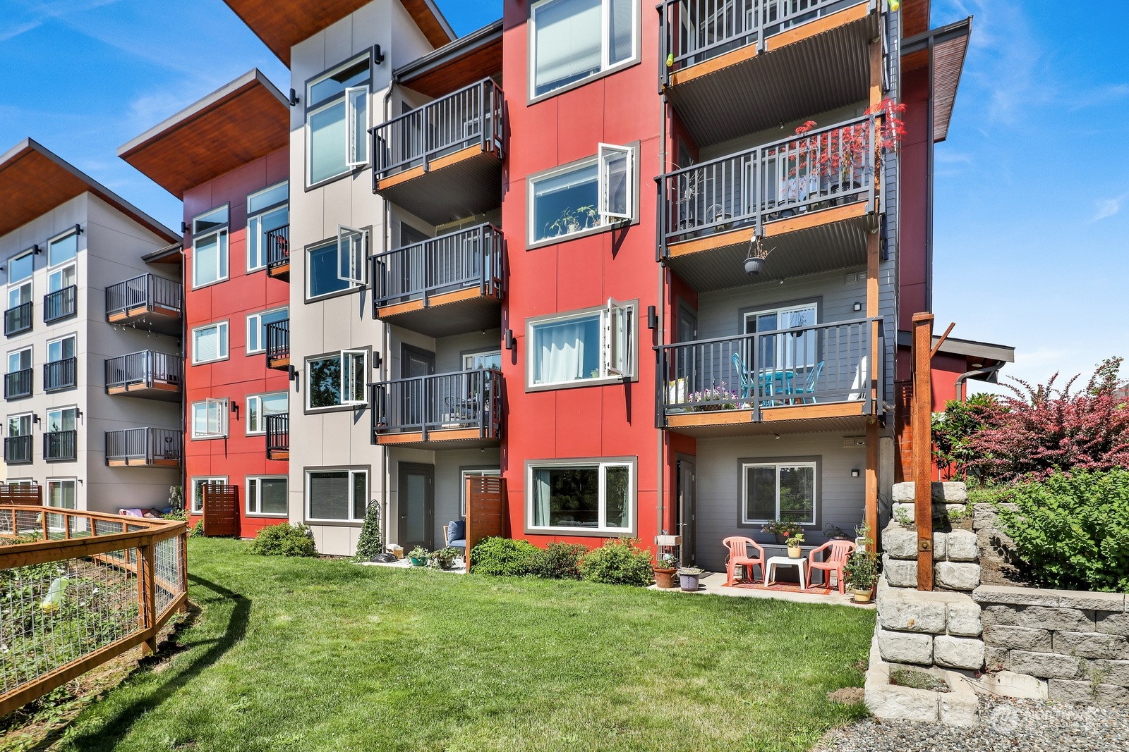 1882 Front Street, Unit 111 Lynden, WA 98264 - Photo 27 of 29 a view of a brick building with a yard