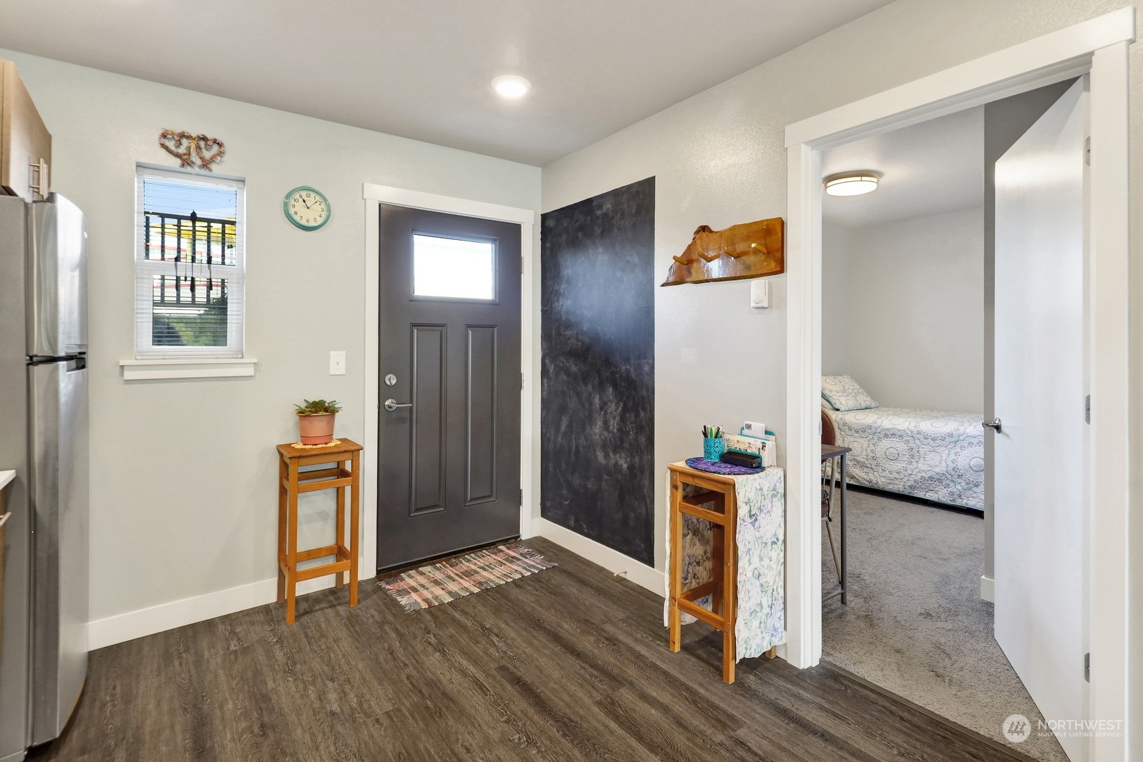 1882 Front Street, Unit 111 Lynden, WA 98264 - Photo 4 of 29 a view of a hallway with wooden floor and windows