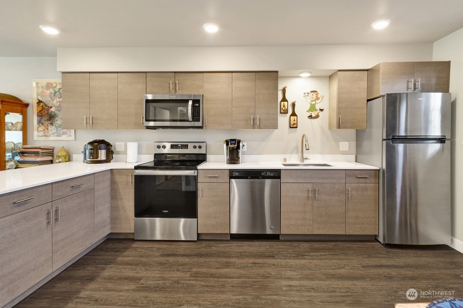 1882 Front Street, Unit 111 Lynden, WA 98264 - Photo 6 of 29 a kitchen with cabinets and stainless steel appliances