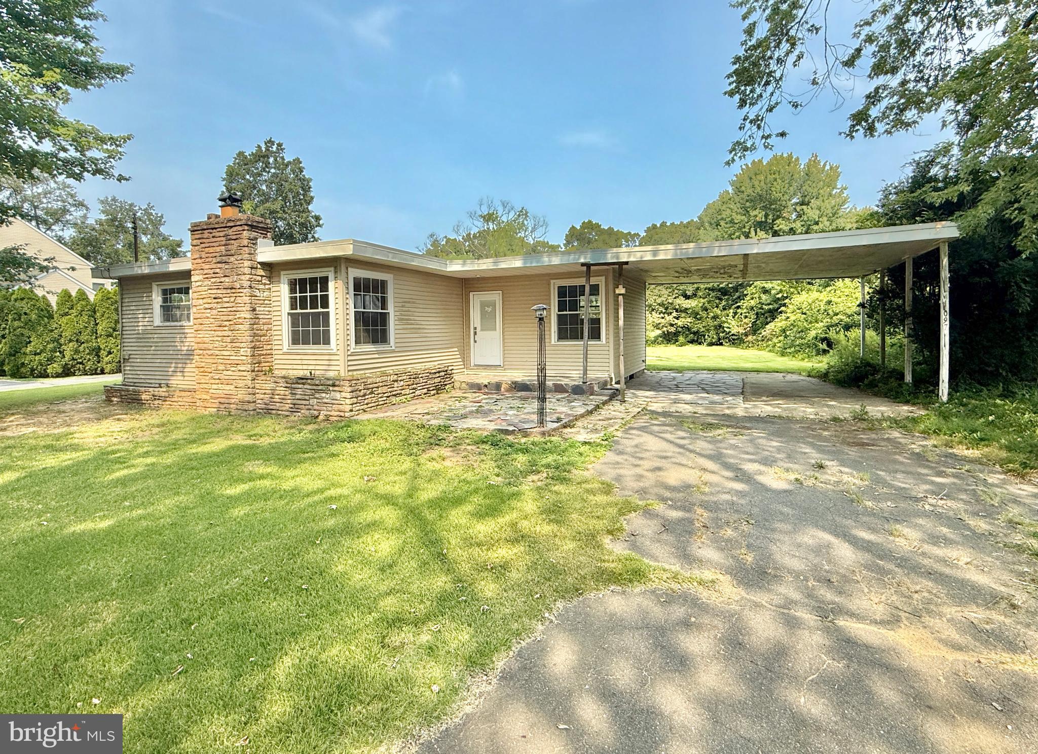 1097 Dutch Mill Road Newfield, NJ 08344 - Photo 1 of 23 a front view of a house with garden