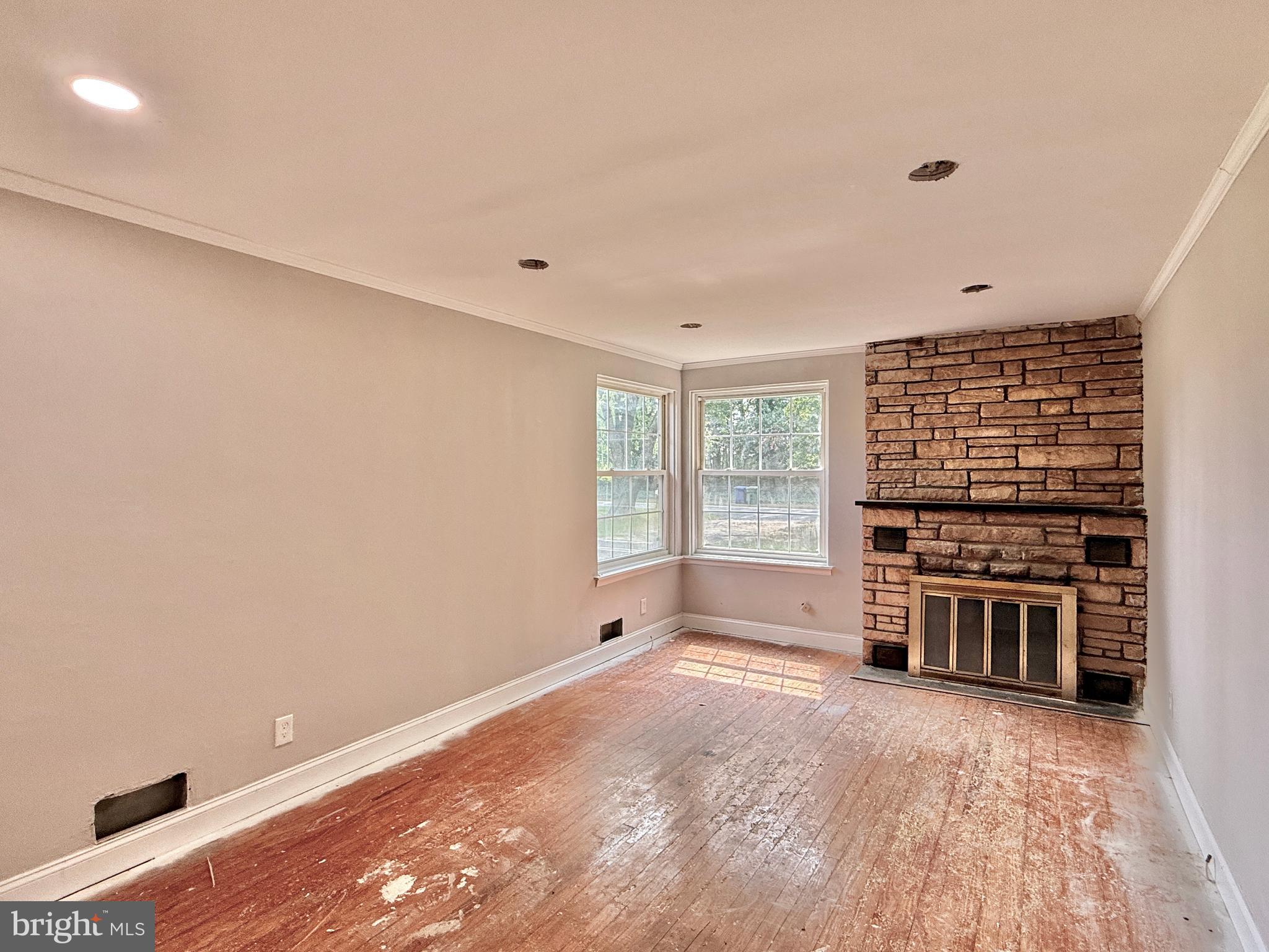 1097 Dutch Mill Road Newfield, NJ 08344 - Photo 11 of 23 a view of an empty room with a window and a kitchen