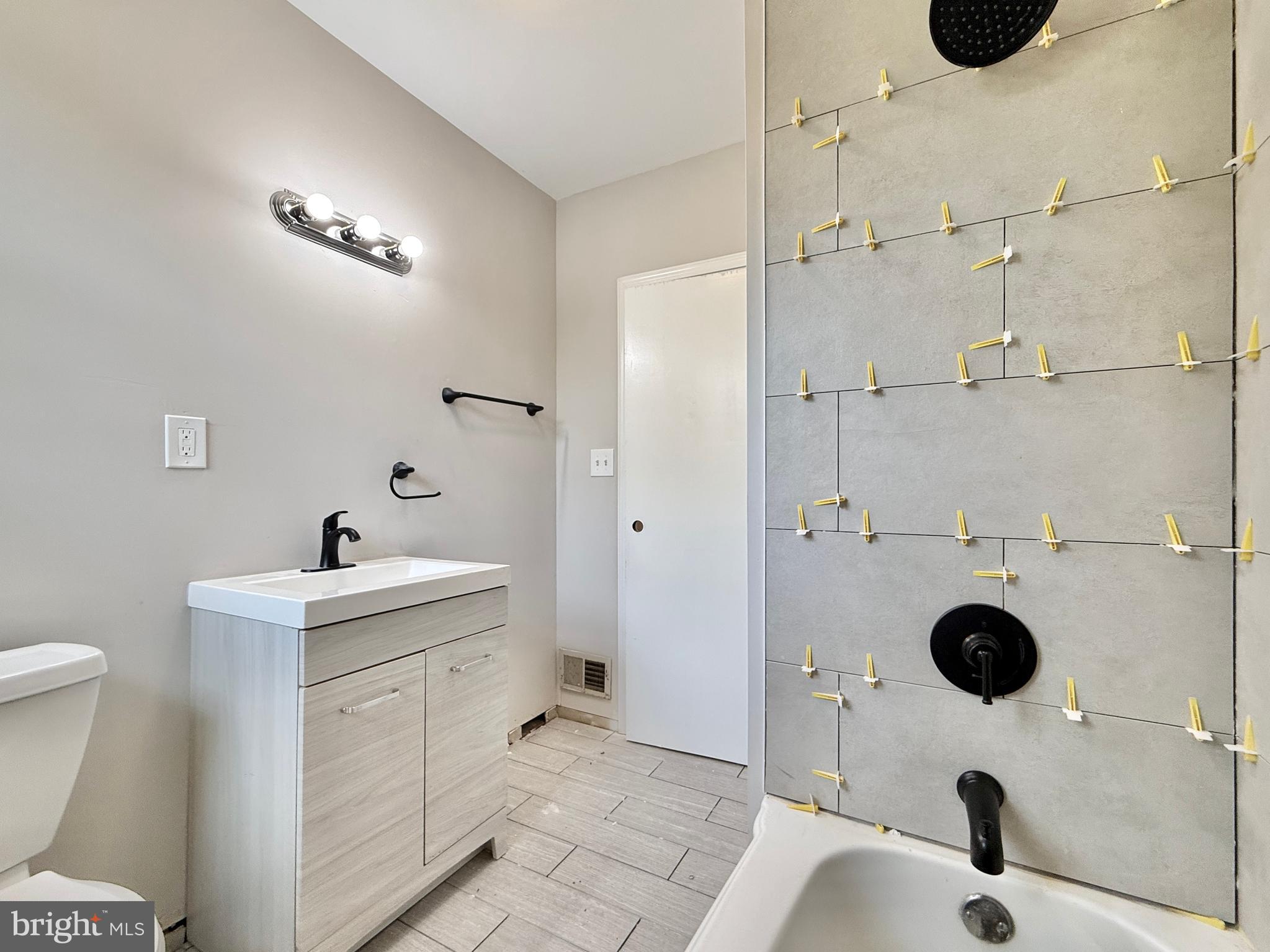1097 Dutch Mill Road Newfield, NJ 08344 - Photo 20 of 23 a bathroom with a sink toilet and shower