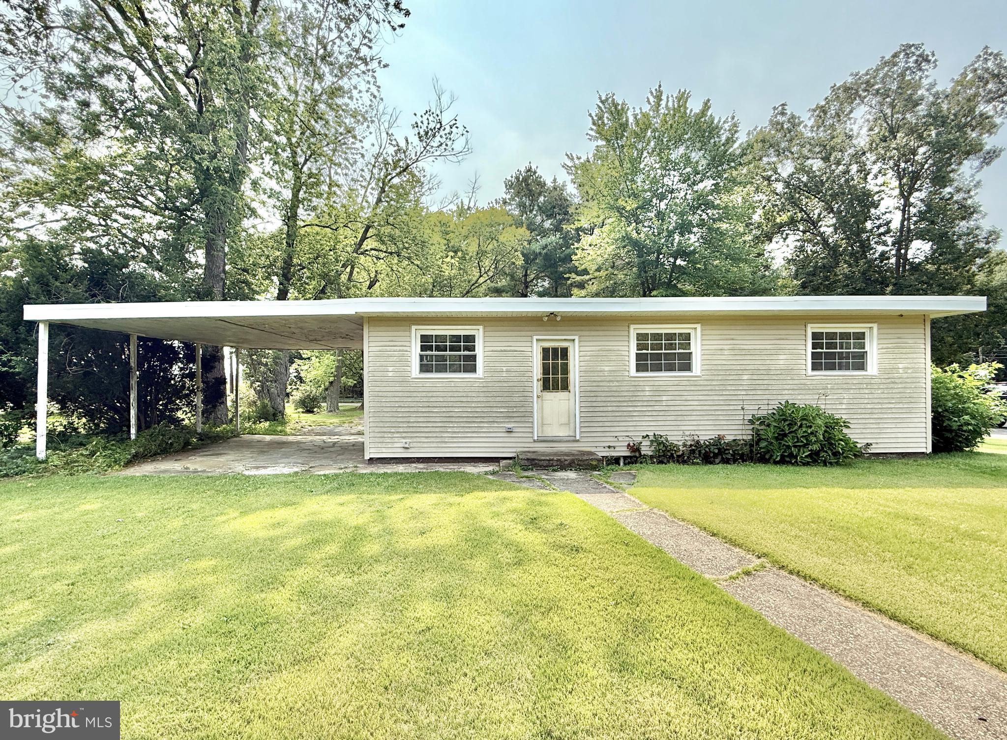 1097 Dutch Mill Road Newfield, NJ 08344 - Photo 5 of 23 a view of a house with a yard and sitting area