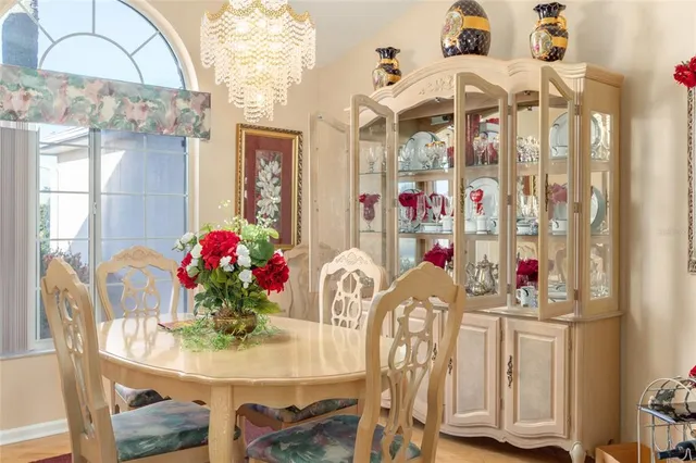 a very nice looking dining room with a table and chairs