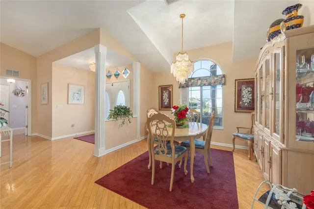 a view of a dining room with furniture window and wooden floor