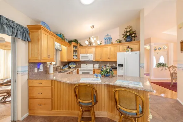 a spacious bathroom with double vanity and a mirror
