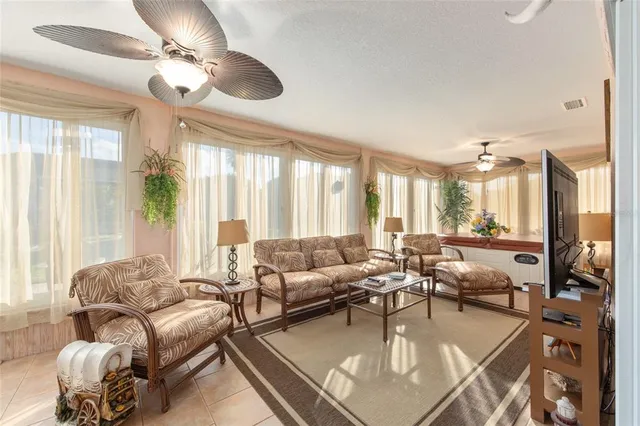 a view of a livingroom with furniture and a large window