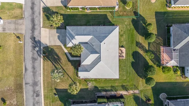 an aerial view of a residential apartment building with a yard